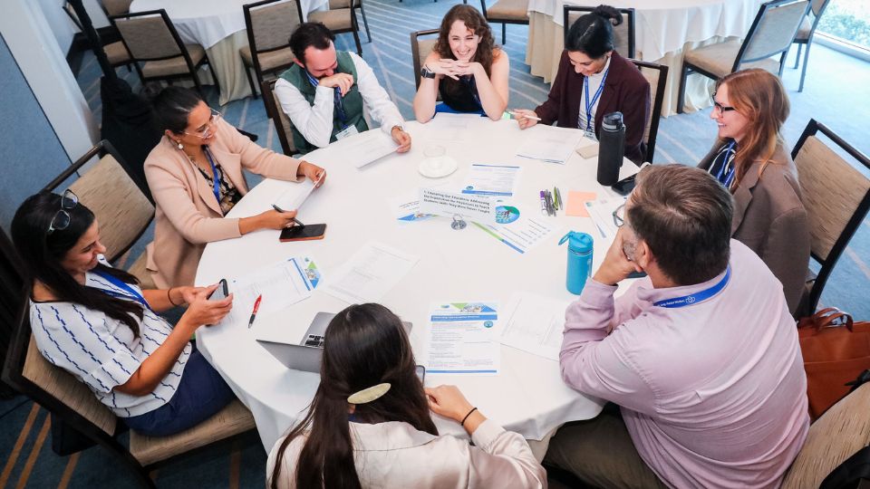 Group collaborating at round table